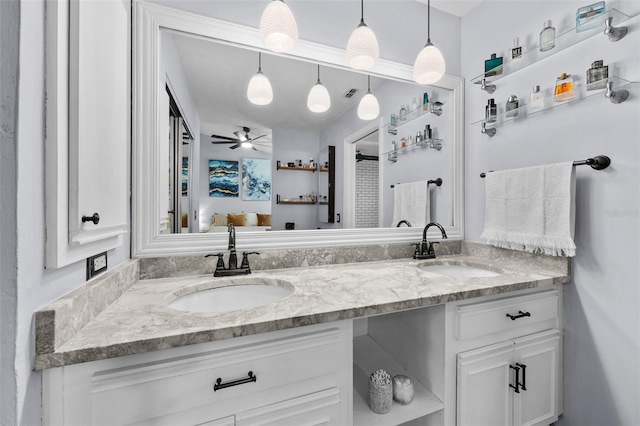 full bath featuring a ceiling fan, a sink, and double vanity