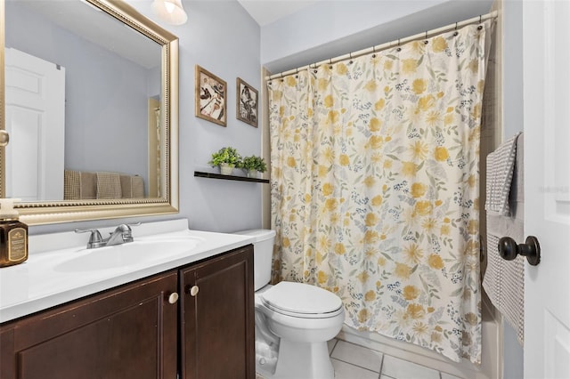 full bath featuring toilet, vanity, shower / bath combo with shower curtain, and tile patterned floors