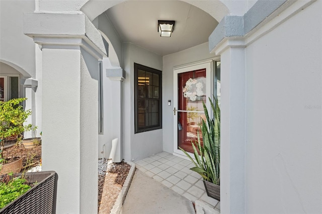 doorway to property with stucco siding