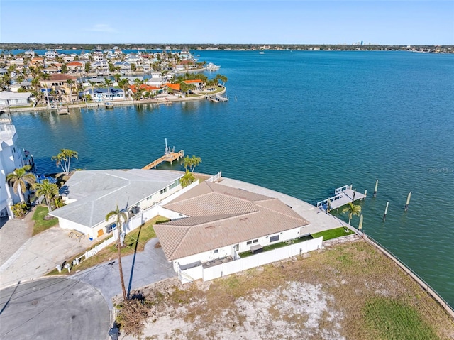 birds eye view of property with a residential view and a water view