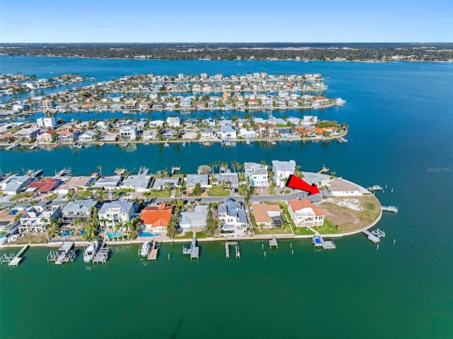 bird's eye view featuring a water view and a residential view