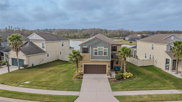 view of front of house featuring a garage and a front yard