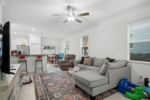 living area with visible vents, ceiling fan, light tile patterned flooring, crown molding, and recessed lighting