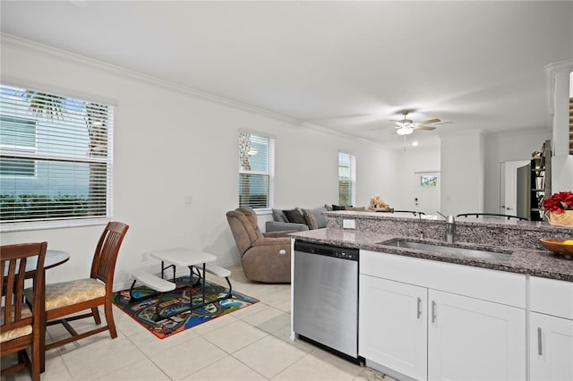 kitchen with a sink, white cabinetry, ornamental molding, dishwasher, and dark stone countertops