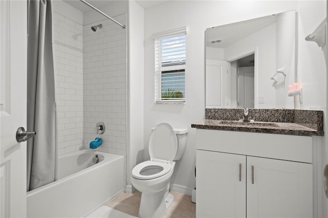 bathroom with tile patterned flooring, toilet, visible vents, vanity, and shower / bath combo