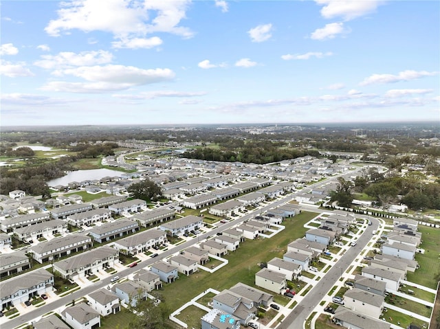 birds eye view of property featuring a water view and a residential view