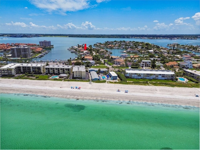 drone / aerial view with a beach view and a water view