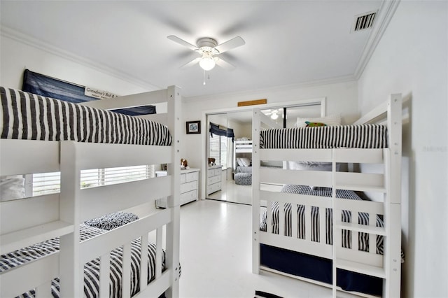 bedroom featuring a ceiling fan, visible vents, and crown molding