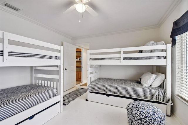 bedroom featuring ornamental molding, visible vents, and a ceiling fan