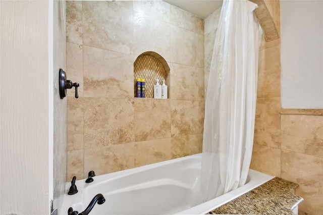 full bathroom featuring tiled shower / bath combo