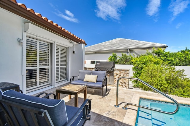 view of patio / terrace with a fenced in pool and outdoor lounge area