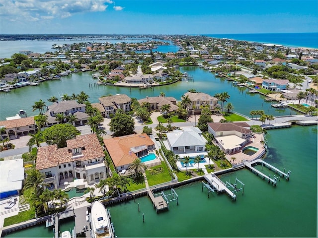 drone / aerial view with a residential view and a water view