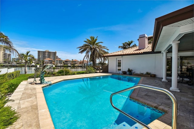 205 Harrison Ave, Belleair Beach, FL 33786 - pool featuring a patio and a water view