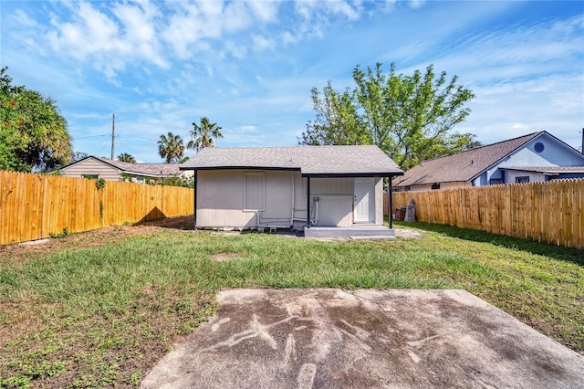 view of yard with an outbuilding and a patio