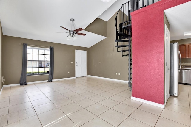 unfurnished living room with light tile patterned floors, ceiling fan, and lofted ceiling