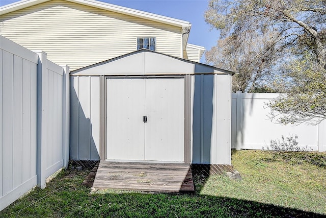 view of shed with a fenced backyard