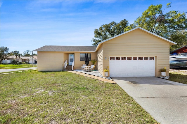 ranch-style house with a front lawn, an attached garage, and driveway