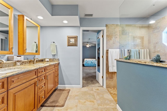 bathroom featuring vanity and a tile shower