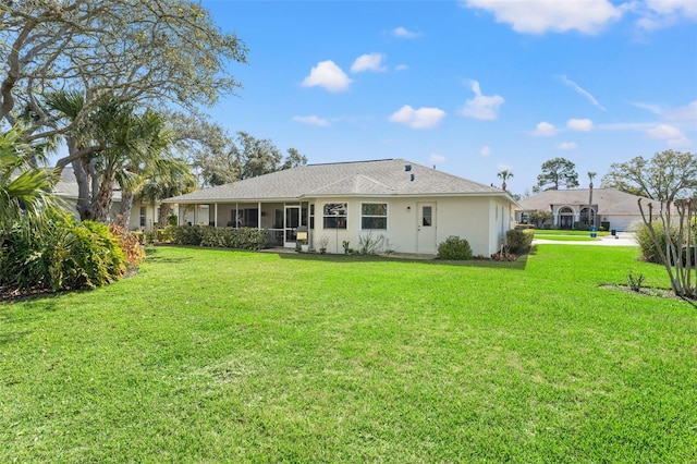 back of house featuring a lawn