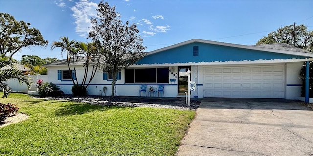 ranch-style house with stucco siding, concrete driveway, fence, a garage, and a front lawn