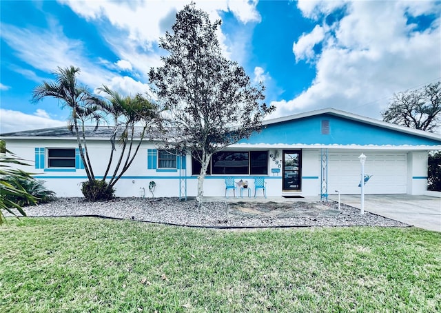 ranch-style home with stucco siding, driveway, a front lawn, and a garage