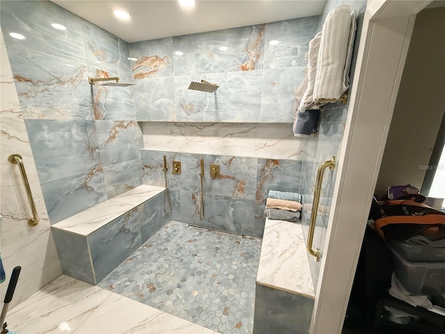 bathroom with a tile shower