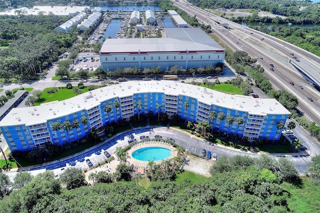 birds eye view of property with a water view