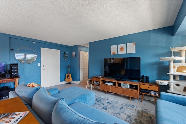 living room with light tile patterned flooring and a textured ceiling