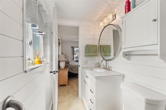 bathroom featuring vanity and toilet