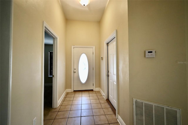 entryway featuring light tile patterned flooring