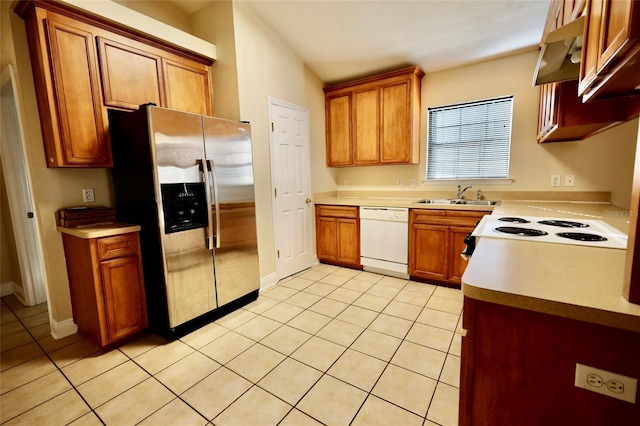 kitchen featuring white dishwasher, stovetop, light tile patterned floors, sink, and stainless steel fridge with ice dispenser