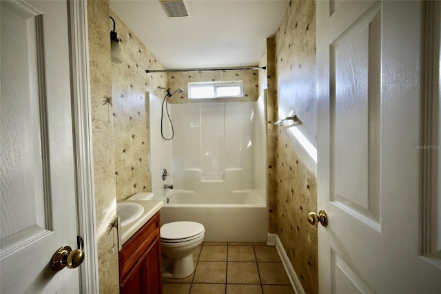 full bathroom featuring toilet, vanity, tile patterned flooring, and tub / shower combination