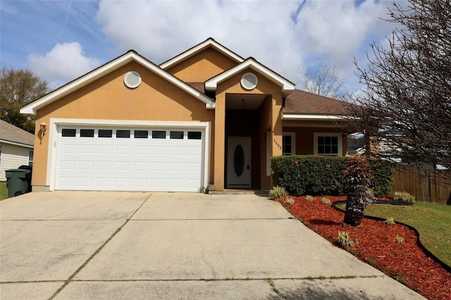 single story home with stucco siding, driveway, a garage, and fence