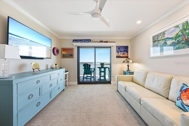 living area with ornamental molding, light colored carpet, baseboards, and a ceiling fan