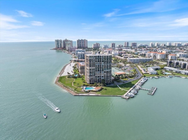 drone / aerial view featuring a water view and a city view