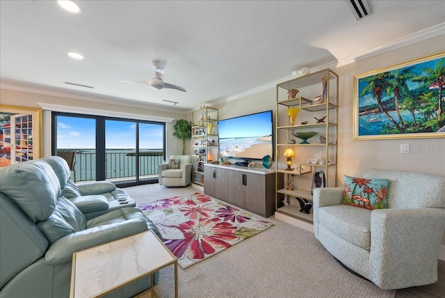 living area featuring light carpet, ornamental molding, a ceiling fan, and recessed lighting