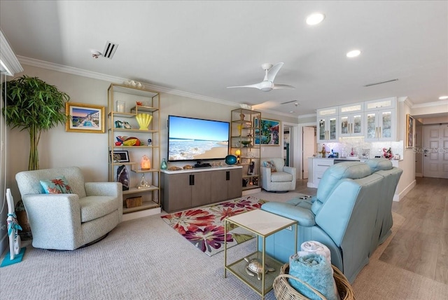 living room with recessed lighting, crown molding, and ceiling fan