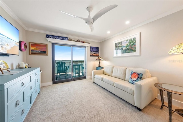 living area with ceiling fan, baseboards, crown molding, and light colored carpet