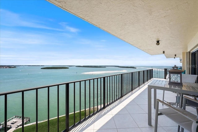 balcony featuring a water view