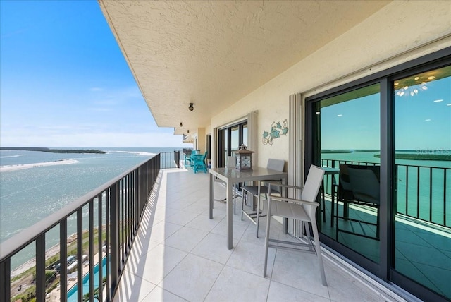 balcony featuring a water view