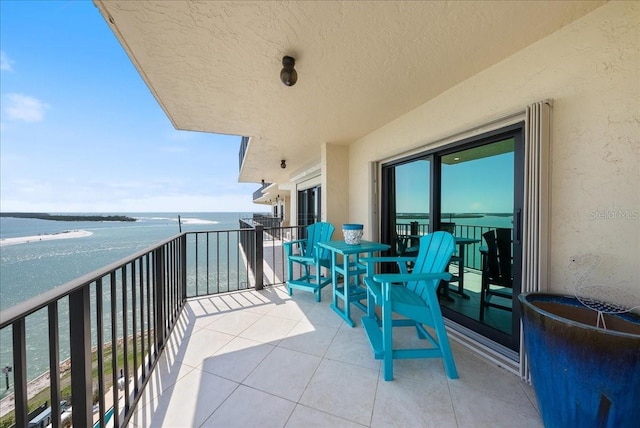 balcony featuring a water view