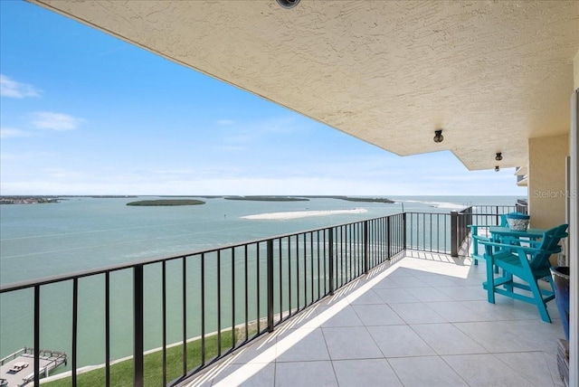 balcony featuring a water view