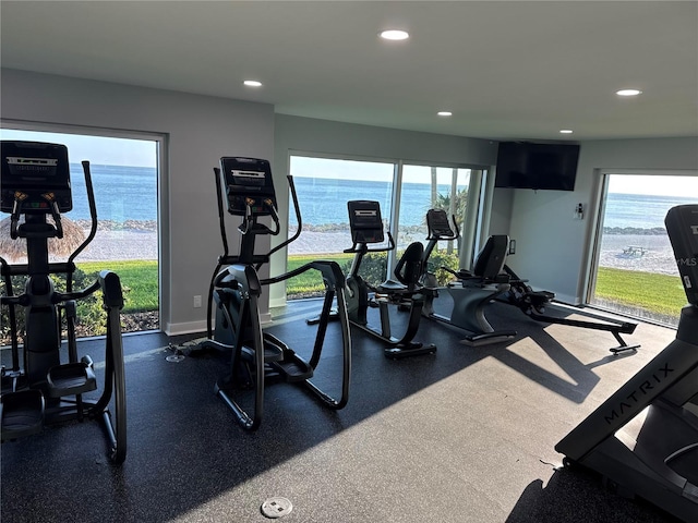 exercise room featuring recessed lighting and baseboards