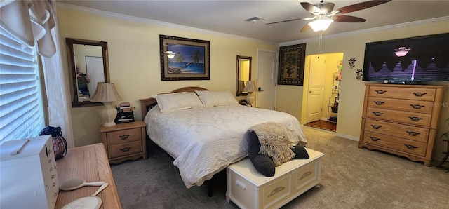 bedroom with crown molding, carpet floors, and ceiling fan