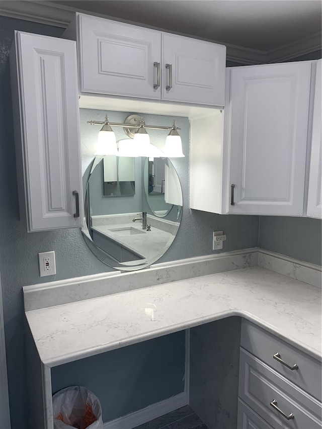 interior space featuring light stone countertops and white cabinets