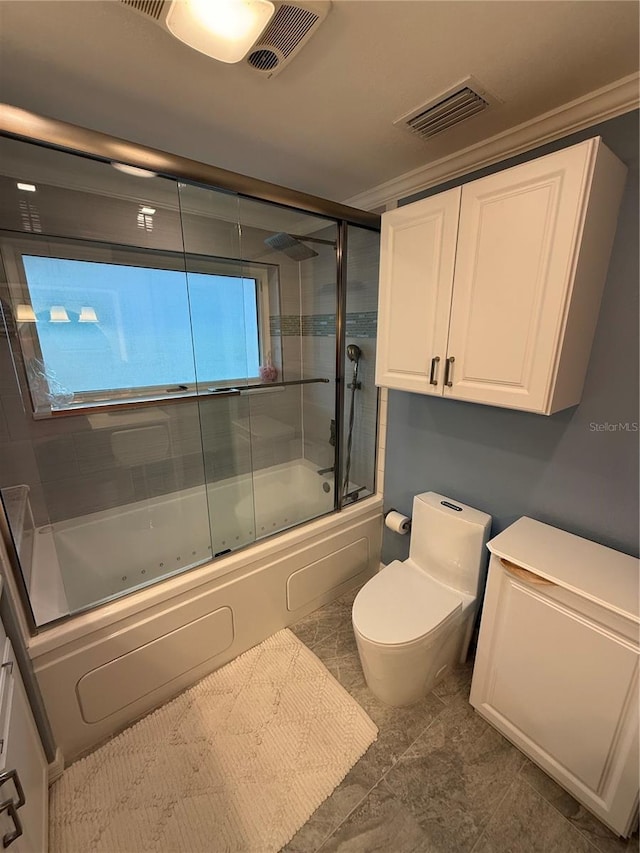 bathroom featuring shower / bath combination with glass door, visible vents, and toilet