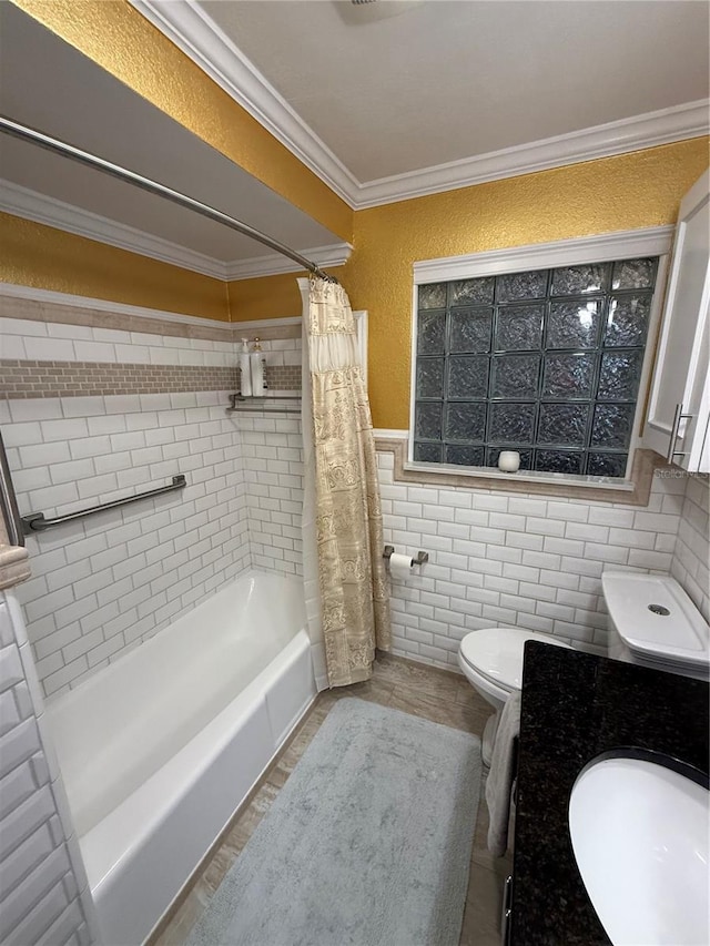 bathroom with wainscoting, vanity, toilet, ornamental molding, and shower / bath combo with shower curtain