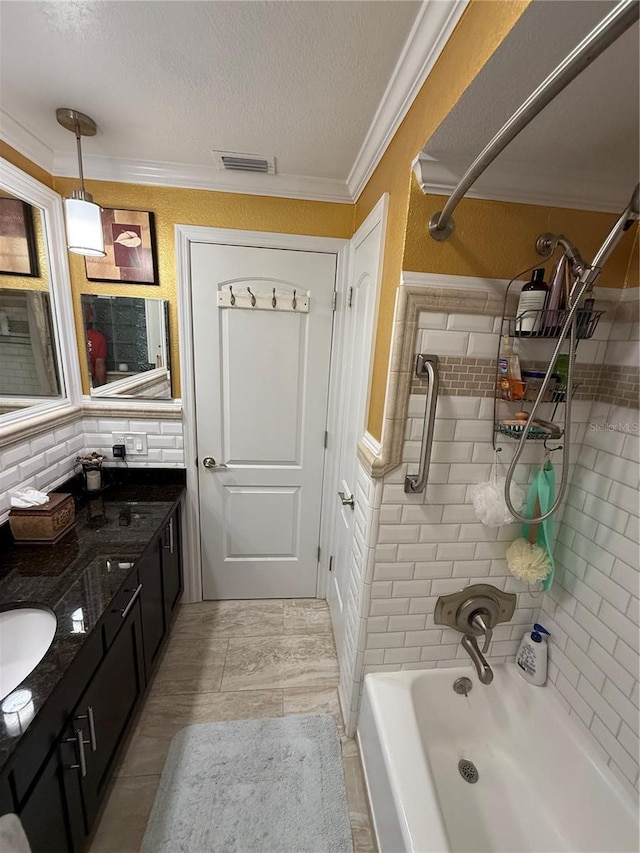 full bath with crown molding, a textured ceiling, vanity,  shower combination, and visible vents