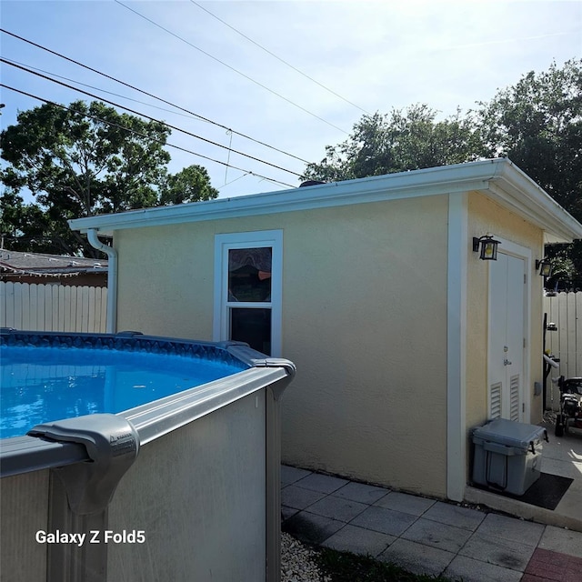 view of swimming pool featuring fence and a fenced in pool