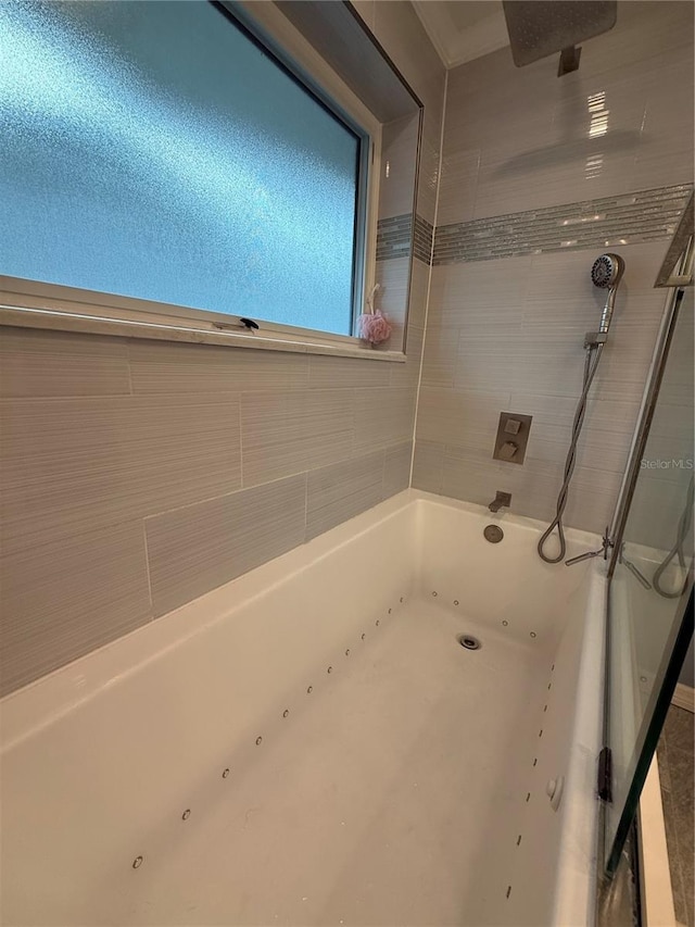 full bathroom with a tub to relax in and walk in shower